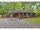 Charming brick house with a cozy front porch, well-manicured landscaping, and a welcoming entrance at 1211 Eastwood Ave, Hanahan, SC 29410
