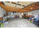Spacious detached garage with exposed rafters, work benches and ample storage space at 1211 Eastwood Ave, Hanahan, SC 29410