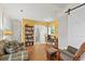 Multi-functional living space with hardwood floors, cozy seating, a desk, and a sliding barn door at 1211 Eastwood Ave, Hanahan, SC 29410