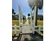 Pathway through a white gate leading to the beach and ocean beyond at 126 Jungle Rd # 7B, Edisto Beach, SC 29438