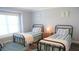 Bedroom with two twin-sized beds, coastal decor, and a bright, airy feel at 126 Jungle Rd # 7B, Edisto Beach, SC 29438