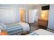 Bedroom featuring twin beds, hardwood floors, a closet, and access to other rooms at 126 Jungle Rd # 7B, Edisto Beach, SC 29438