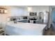 Modern kitchen with stainless steel appliances, quartz countertops, and ample cabinet space at 126 Jungle Rd # 7B, Edisto Beach, SC 29438