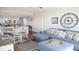 Cozy living area with open-concept design, comfortable seating, and a large clock at 126 Jungle Rd # 7B, Edisto Beach, SC 29438