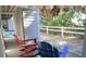 Inviting patio area with colorful Adirondack chairs near the private access to the beach at 126 Jungle Rd # 7B, Edisto Beach, SC 29438