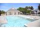 Outdoor pool with crystal clear water, a covered area, and well-maintained surroundings at 126 Jungle Rd # 7B, Edisto Beach, SC 29438
