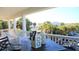Scenic porch view with outdoor table setting and decorative lanterns at 126 Jungle Rd # 7B, Edisto Beach, SC 29438