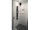 Luxurious walk-in shower with multiple shower heads, a glass door, and a tiled shower niche at 126 Jungle Rd # 7B, Edisto Beach, SC 29438