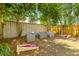 Charming backyard with lounge furniture, a fire pit, and fun cornhole game at 13 H St, Charleston, SC 29403