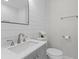 Bright bathroom features a modern sink, gray vanity and sleek mirror at 13 H St, Charleston, SC 29403
