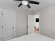 Bright bedroom featuring a ceiling fan and neutral colors and tones with 2 doors at 13 H St, Charleston, SC 29403