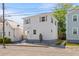 Charming two-story home with white siding, updated windows, and a well-manicured landscape at 13 H St, Charleston, SC 29403
