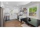 Bright kitchen featuring white cabinets, stainless steel appliances, and a view of the outdoor scenery at 13 H St, Charleston, SC 29403