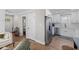 Open-concept kitchen with stainless steel appliances and hardwood floors at 13 H St, Charleston, SC 29403