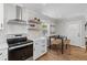 Kitchen with stainless steel appliances and dining area at 13 H St, Charleston, SC 29403