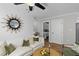 Cozy living room features hardwood floors, a ceiling fan, modern décor, and bright natural light at 13 H St, Charleston, SC 29403