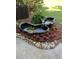 Beautiful backyard fish pond surrounded by landscaping at 1307 Ventura Pl, Mount Pleasant, SC 29464