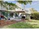 An inviting outdoor patio includes a charcoal grill, chairs, and garden beds, perfect for entertaining and relaxation at 1307 Ventura Pl, Mount Pleasant, SC 29464