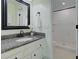 Well-lit bathroom features a granite countertop vanity and a tiled shower, offering a clean, modern aesthetic at 1307 Ventura Pl, Mount Pleasant, SC 29464
