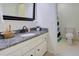 Bathroom features granite countertop, white cabinets, and a view of the toilet/shower area, and a basket at 1307 Ventura Pl, Mount Pleasant, SC 29464