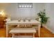 Inviting dining area features a sleek table with bench seating, a leafy green plant, and stylish lighting at 1307 Ventura Pl, Mount Pleasant, SC 29464