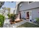 Charming townhouse featuring a landscaped front yard and cozy outdoor seating, creating an inviting entrance at 1307 Ventura Pl, Mount Pleasant, SC 29464