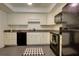 Well-equipped kitchen with white cabinetry, granite countertops, and sleek black appliances at 1307 Ventura Pl, Mount Pleasant, SC 29464