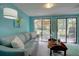 Bright sunroom with seating area and a view to the outdoor patio at 1307 Ventura Pl, Mount Pleasant, SC 29464