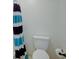 Toilet with blue and black striped shower curtain at 1307 Ventura Pl, Mount Pleasant, SC 29464