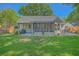 Expansive backyard showcasing an outdoor patio, screened in porch and lush lawn at 1315 Old Mill Ln, Mount Pleasant, SC 29464