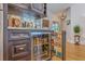Custom bar area features a beverage refrigerator, dark cabinetry and unique mirrored backsplash at 1315 Old Mill Ln, Mount Pleasant, SC 29464