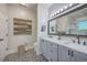 Spacious bathroom with dual vanities, decorative tile floors, and ample lighting at 1315 Old Mill Ln, Mount Pleasant, SC 29464