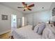 Neutral bedroom with view to Primary bath, closet space, ceiling fan and natural light at 1315 Old Mill Ln, Mount Pleasant, SC 29464