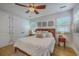 Comfortable bedroom features neutral decor, ceiling fan and large window letting in light at 1315 Old Mill Ln, Mount Pleasant, SC 29464