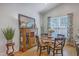 Bright dining room with a wood table, decorative hutch, and natural light at 1315 Old Mill Ln, Mount Pleasant, SC 29464