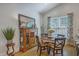 Bright dining room with a wood table, decorative hutch, and natural light at 1315 Old Mill Ln, Mount Pleasant, SC 29464