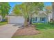 Charming single-story home with a well-manicured lawn, blue shutters, and inviting front porch seating at 1315 Old Mill Ln, Mount Pleasant, SC 29464