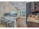 Modern kitchen island with breakfast bar seating and sleek countertops and fixtures at 1315 Old Mill Ln, Mount Pleasant, SC 29464