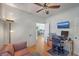 Comfortable home office featuring a ceiling fan, a work area, and access to the kitchen at 1315 Old Mill Ln, Mount Pleasant, SC 29464