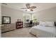 Bedroom featuring a comfortable bed, workspace, and ample natural light at 1339 River Otter Court, Mount Pleasant, SC 29466