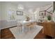 Formal dining room with a table, decorative light fixtures, and hardwood floors at 1339 River Otter Court, Mount Pleasant, SC 29466