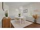 Dining room showcasing plantation shutters, modern lighting, and hardwood flooring at 1339 River Otter Court, Mount Pleasant, SC 29466