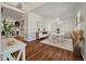 Bright dining room with hardwood floors, white wainscoting, and stylish modern light fixtures at 1339 River Otter Court, Mount Pleasant, SC 29466