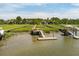 Private dock area equipped with a boat lift and access platform on a waterfront property at 1339 River Otter Court, Mount Pleasant, SC 29466