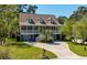 Charming two-story home with a welcoming front porch and well-manicured lawn at 1339 River Otter Court, Mount Pleasant, SC 29466