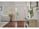 Inviting foyer features hardwood floors, natural light, and a modern coat rack at 1339 River Otter Court, Mount Pleasant, SC 29466