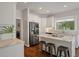 Modern kitchen featuring stainless steel appliances, white cabinets, and granite countertops at 1339 River Otter Court, Mount Pleasant, SC 29466