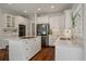 Bright kitchen features granite counters, stainless appliances, and a large central island at 1339 River Otter Court, Mount Pleasant, SC 29466