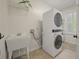 Laundry room includes a stackable washer and dryer, sink, and storage at 1339 River Otter Court, Mount Pleasant, SC 29466