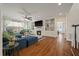 Spacious living room featuring built-in shelving, a fireplace, and hardwood floors at 1339 River Otter Court, Mount Pleasant, SC 29466